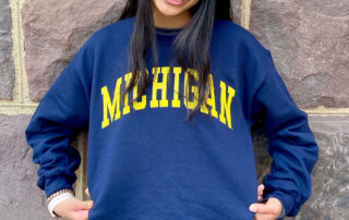 girl smiling in Michigan shirt